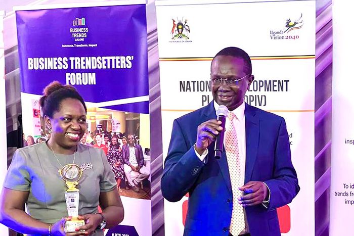 Hon Daudi Migereko giving a speech after recieving his award as a trend setter for his work in setting up FINCA Uganda