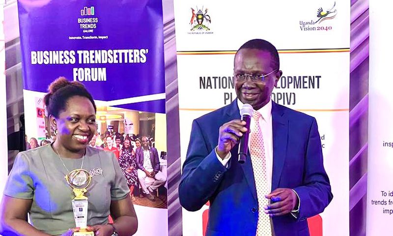 Hon Daudi Migereko giving a speech after recieving his award as a trend setter for his work in setting up FINCA Uganda