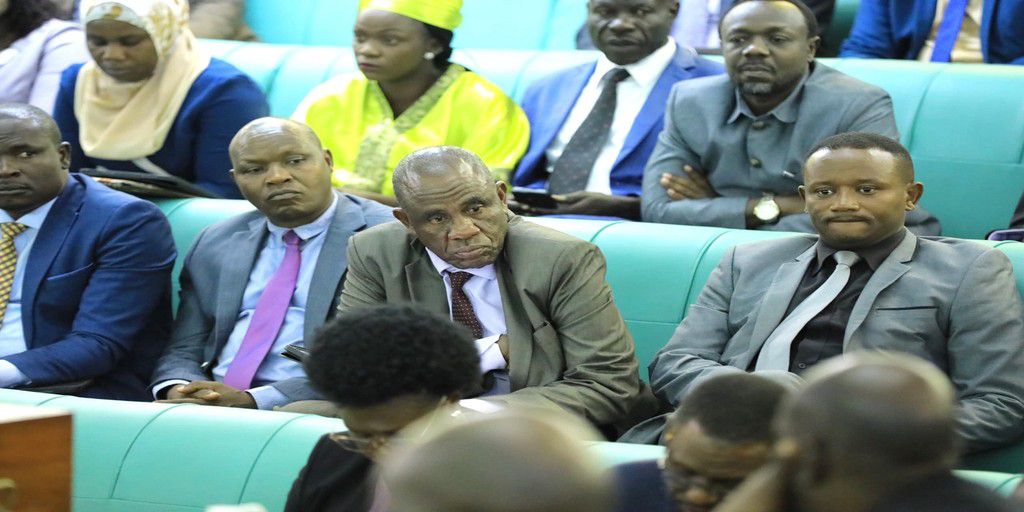 MPs listening to the report from Chairperson of the Committee on Health