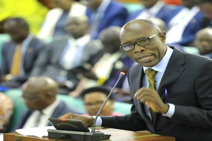 Dr. Jospeh Ruyonga, the Chairperson of the Committee on Health, presenting his statement on the forced HIV-AIDS testing