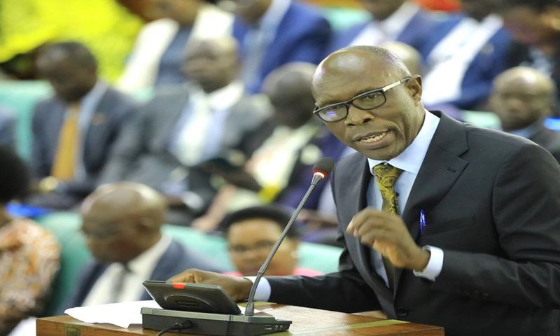 Dr. Jospeh Ruyonga, the Chairperson of the Committee on Health, presenting his statement on the forced HIV-AIDS testing