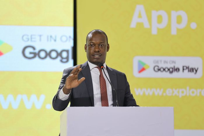 Minister Martin Mugarra speaking at the Explore Uganda app launch