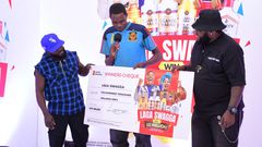 Shafiq Kyewalabye gets a check from Madrat and Chiko