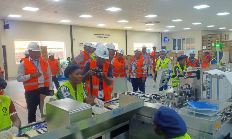 MPs touring a production line at the East African Medical Vitals