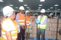 Ben Kavuuya showcasing the company products to the MPs