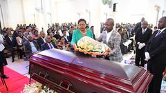 Deputy Speaker Thomas Tayebwa and his wife laying a wreath on Kahenano's remains