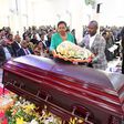 Deputy Speaker Thomas Tayebwa and his wife laying a wreath on Kahenano's remains