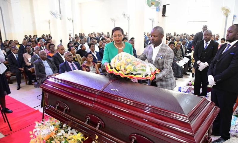 Deputy Speaker Thomas Tayebwa and his wife laying a wreath on Kahenano's remains