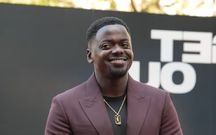 Kaluuya rocked a gold pendant featuring a Buganda logo