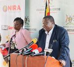 Internal affairs minister Maj Gen Kahinda Otafire flanked by Rosemary Kisembo, the executive director of NIRA