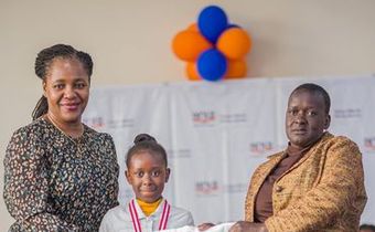 Racheal Nafula from Little Rock School poses for a photo with her mother and the Deputy Director - Cataloguing, classification, and Distribution, KNLS Betty Kalugho during the World Readers Awards at Kenya National Library.