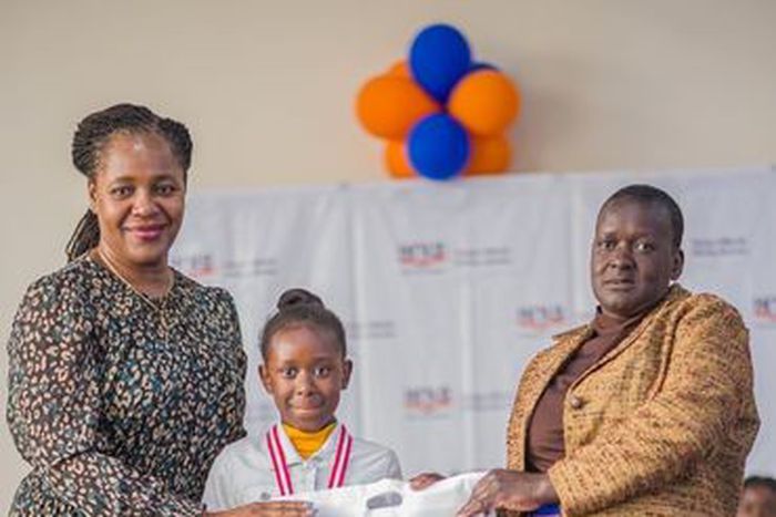 Racheal Nafula from Little Rock School poses for a photo with her mother and the Deputy Director - Cataloguing, classification, and Distribution, KNLS Betty Kalugho during the World Readers Awards at Kenya National Library.