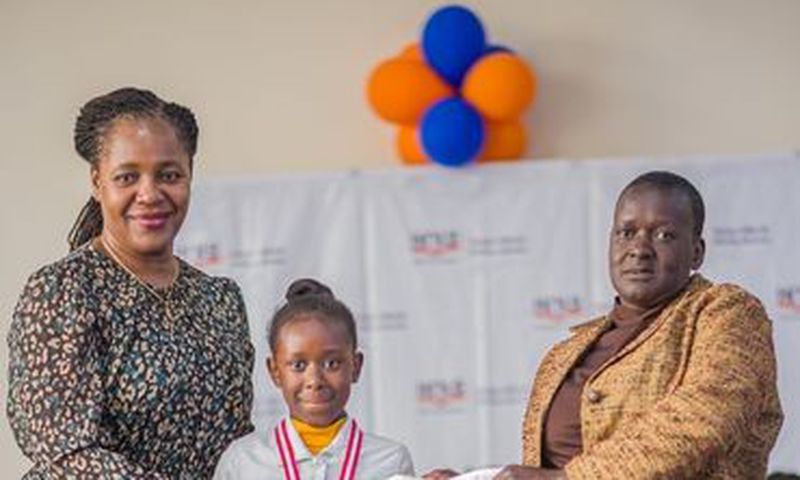 Racheal Nafula from Little Rock School poses for a photo with her mother and the Deputy Director - Cataloguing, classification, and Distribution, KNLS Betty Kalugho during the World Readers Awards at Kenya National Library.