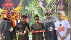 (2nd Left) Uganda Waragi Brand Manager Hillary Baguma and MC Uganda (1st right) Ndeku Nyama Choma organizer at the the launcg of the 4th edition of the festival at Shisa Nyama Village