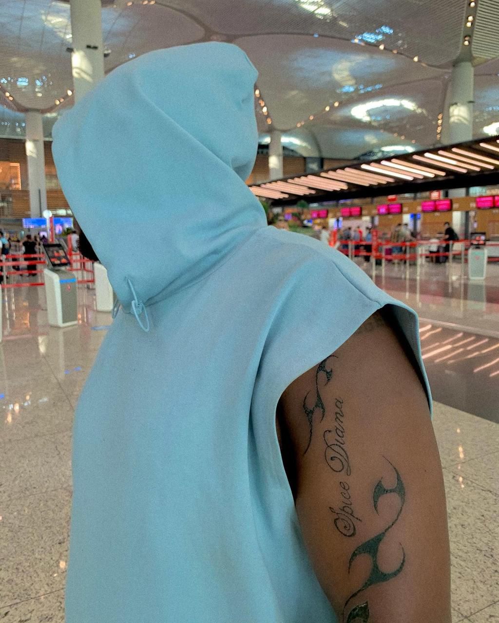 Spice Diana's manager shows off tattoo of her brand name