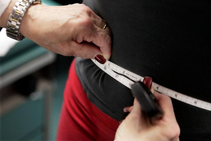 FILE - In this Jan. 20, 2010 file photo, a subject's waist is measured during an obesity prevention study in Chicago. According to a Centers for Disease Control and Prevention study released on Thursday, Feb. 27, 2020, the U.S. obesity rate continues t...