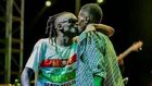 Weasal and Chameleone kissing on stage