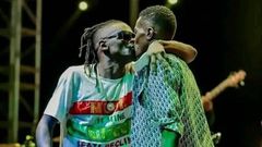 Weasal and Chameleone kissing on stage