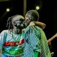 Weasal and Chameleone kissing on stage