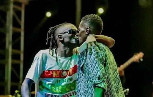 Weasal and Chameleone kissing on stage