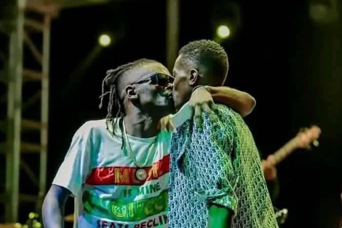 Weasal and Chameleone kissing on stage