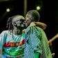 Weasal and Chameleone kissing on stage