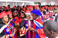 Deputy Speaker Thomas Tayebwa poses with Faridah Nakazibwe at the graduation event