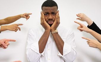 A man holding his face [Image credit: Yan Krukau]