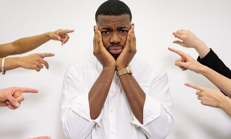 A man holding his face [Image credit: Yan Krukau]