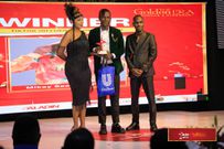Felistus Mwangi, Content Partnerships Manager at TikTok East Africa awarding Mikey Seems 2 Funny, TikTok Influencer of the Year 2023