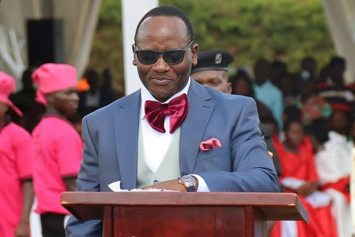 Mathias Mpuuga speaking at the thanksgiving event