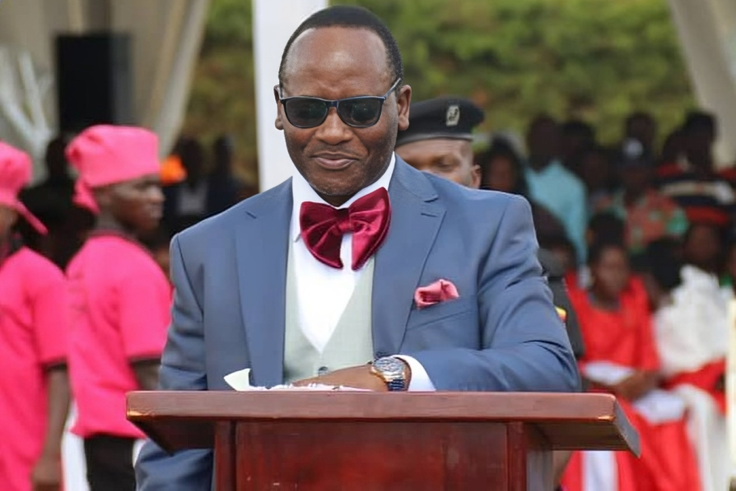 Mathias Mpuuga speaking at the thanksgiving event