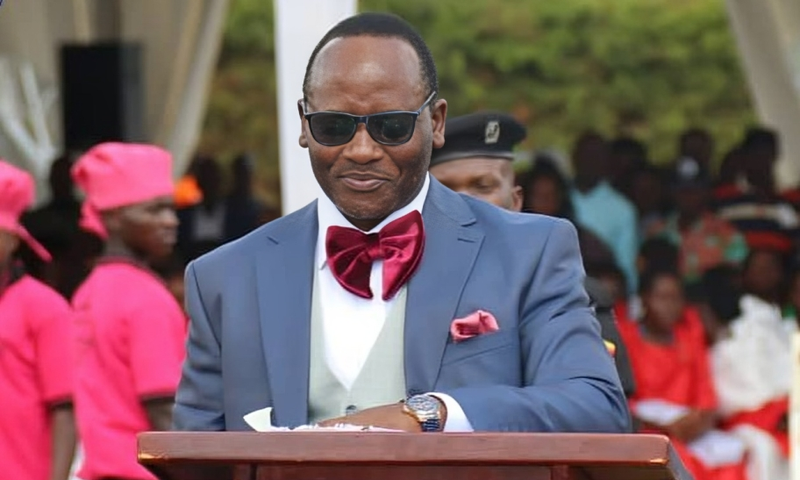 Mathias Mpuuga speaking at the thanksgiving event