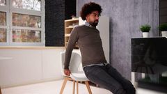 Use a stable chair for triceps dips [iStockphoto]