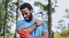 Man experiencing post work out pain