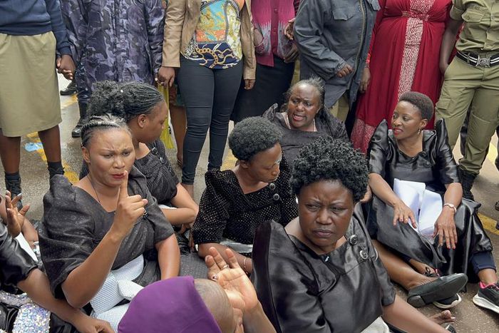 Police rounded up the 11 MPs at the Parliament gate before bundling them in a waiting van (Photo By Hon Mathias Mpuuga