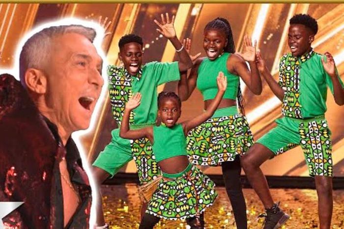 Bruno enjoying the Triplets Ghetto Kids performance