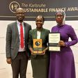 UDB Managing Director, Patricia Ojangole (C), holding the accolade she won for the Sustainability Leader of the Year 2023 at the prestigious Annual Karlsruhe Sustainable Finance Awards in Germany together with UDB Chief Internal Auditor, Stephen Hamya ...