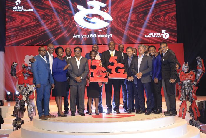 Dr Chris Baryomunsi (C), The Minister of ICT and National Guidance, Airtel Uganda, Managing Director, manoj murali (4th L), Uganda Communications Commission Executive Director, Eng Irene Kaggwa Sewankambo (5th L), tog