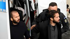 Andrew Tate (L) and his brother Tristan Tate (R) [Photo by DANIEL MIHAILESCU/AFP via Getty Images]