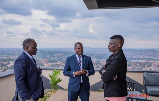 Suuna Ben (right) with Next Media CEO Kin Kariisa (left) and his deputy Joe Kigozi