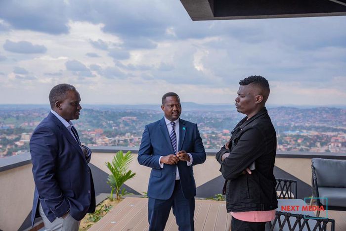 Suuna Ben (right) with Next Media CEO Kin Kariisa (left) and his deputy Joe Kigozi