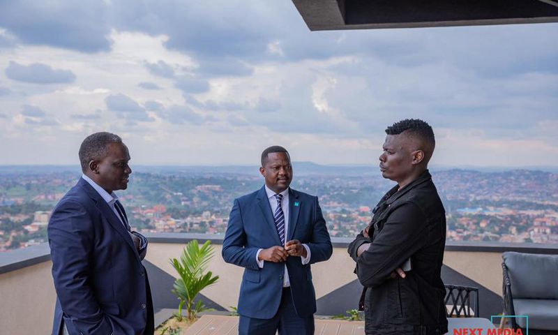 Suuna Ben (right) with Next Media CEO Kin Kariisa (left) and his deputy Joe Kigozi