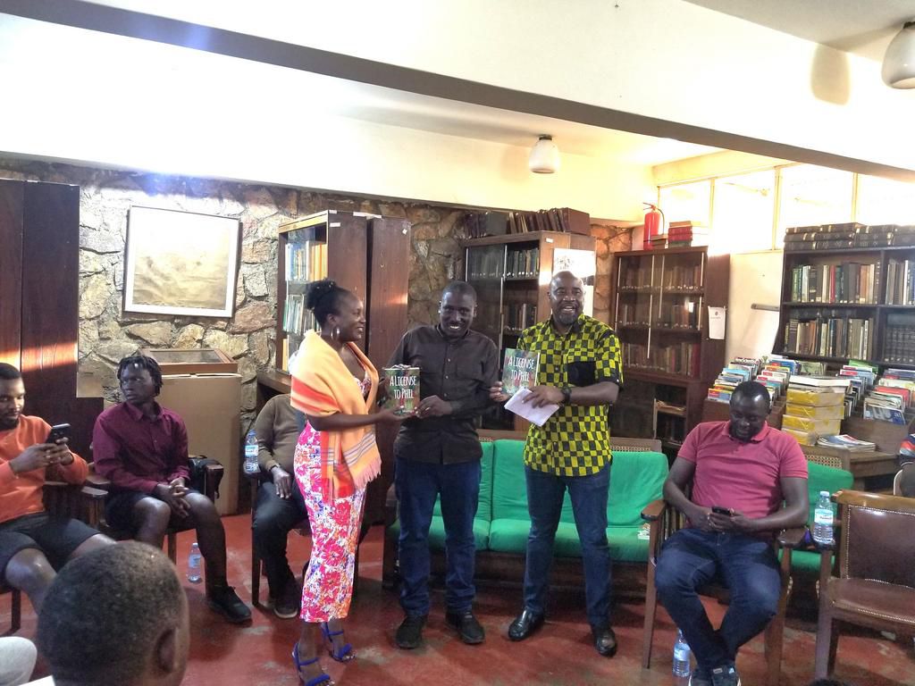 Philip Matogo (centre), Mujuni (right)