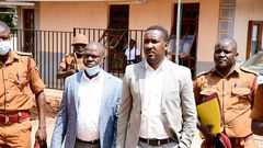 Muhammad-Ssegirinya (L) and Allan Ssewanyana in plainclothes