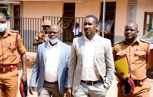 Muhammad-Ssegirinya (L) and Allan Ssewanyana in plainclothes