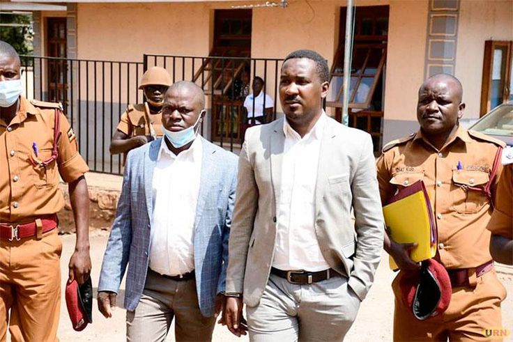 Muhammad-Ssegirinya (L) and Allan Ssewanyana in plainclothes