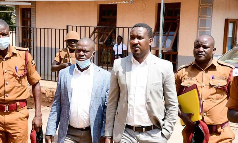 Muhammad-Ssegirinya (L) and Allan Ssewanyana in plainclothes