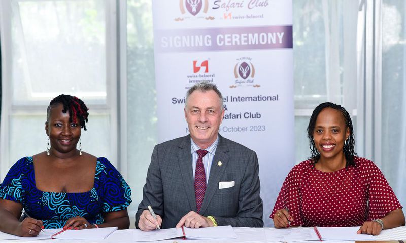 Mukawa (Hotels) Holdings Ltd Directors Ms Clare Njeri Githunguri (left) and Ms Lilian Joy Nyagaki Githunguri (right) exchange the hotel management agreements with Swiss-Belhotel International’s Senior Vice President Laurent Voivenel (centre)
