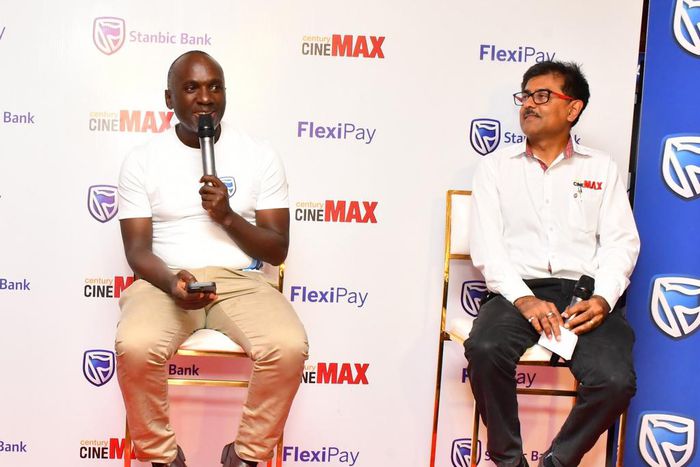 Stanbic's Israel Arinaitwe and Satish Guna, the Century Cinemax General Manager address press